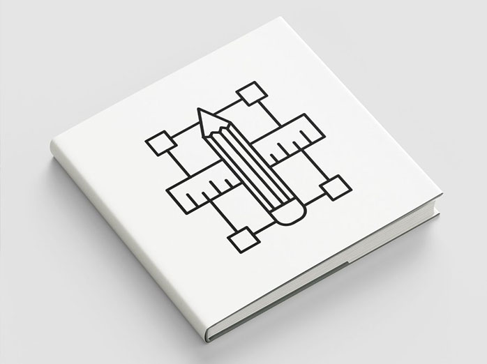 Omslag av en bok med symboler som visar kreativitet; en penna, en linjal och en tom bildruta.